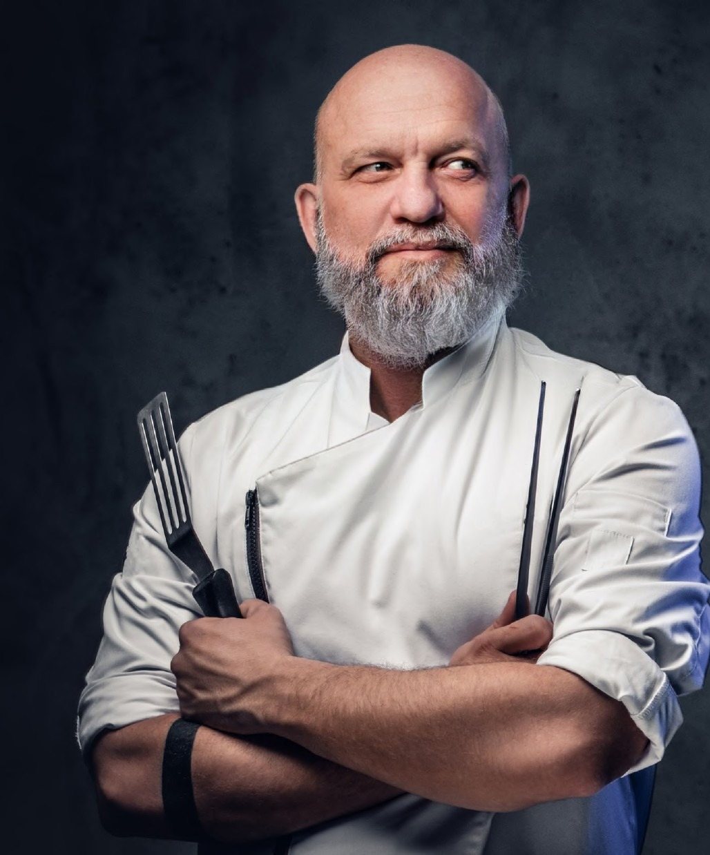 Chef in a custom tailored Kenz chef coat